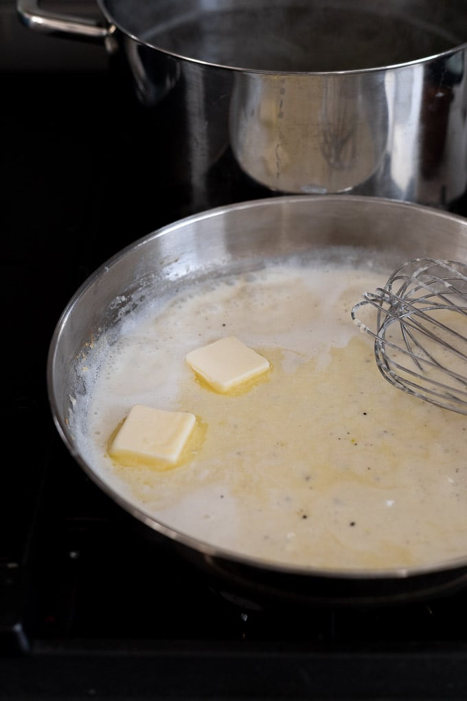 Butter pats in skillet.