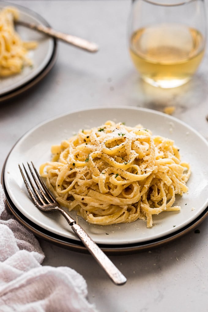 side view of fettuccine alfredo noodles with white wine