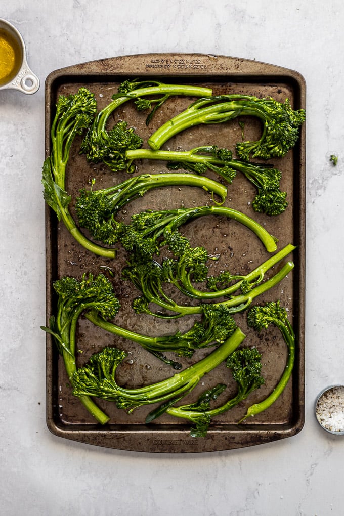 Broccolini on sheet pan before baking.