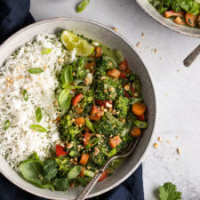 bowl of coconut vegetable stir fry with rice and fork