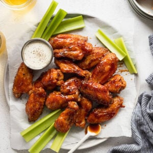 Chicken wings on serving tray with celery.