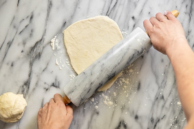 Rolling pin over dough.