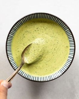 Bowl of green sauce with spoon.
