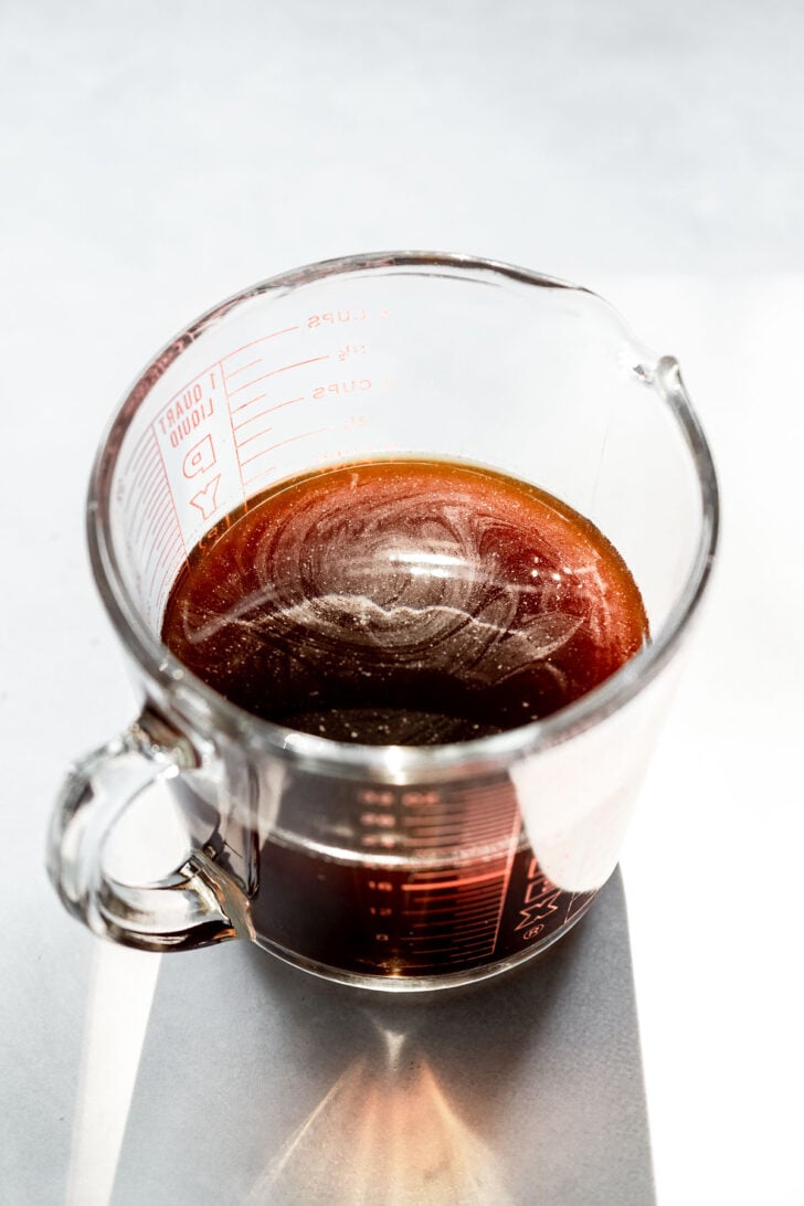 Large measuring cup with cold brew.