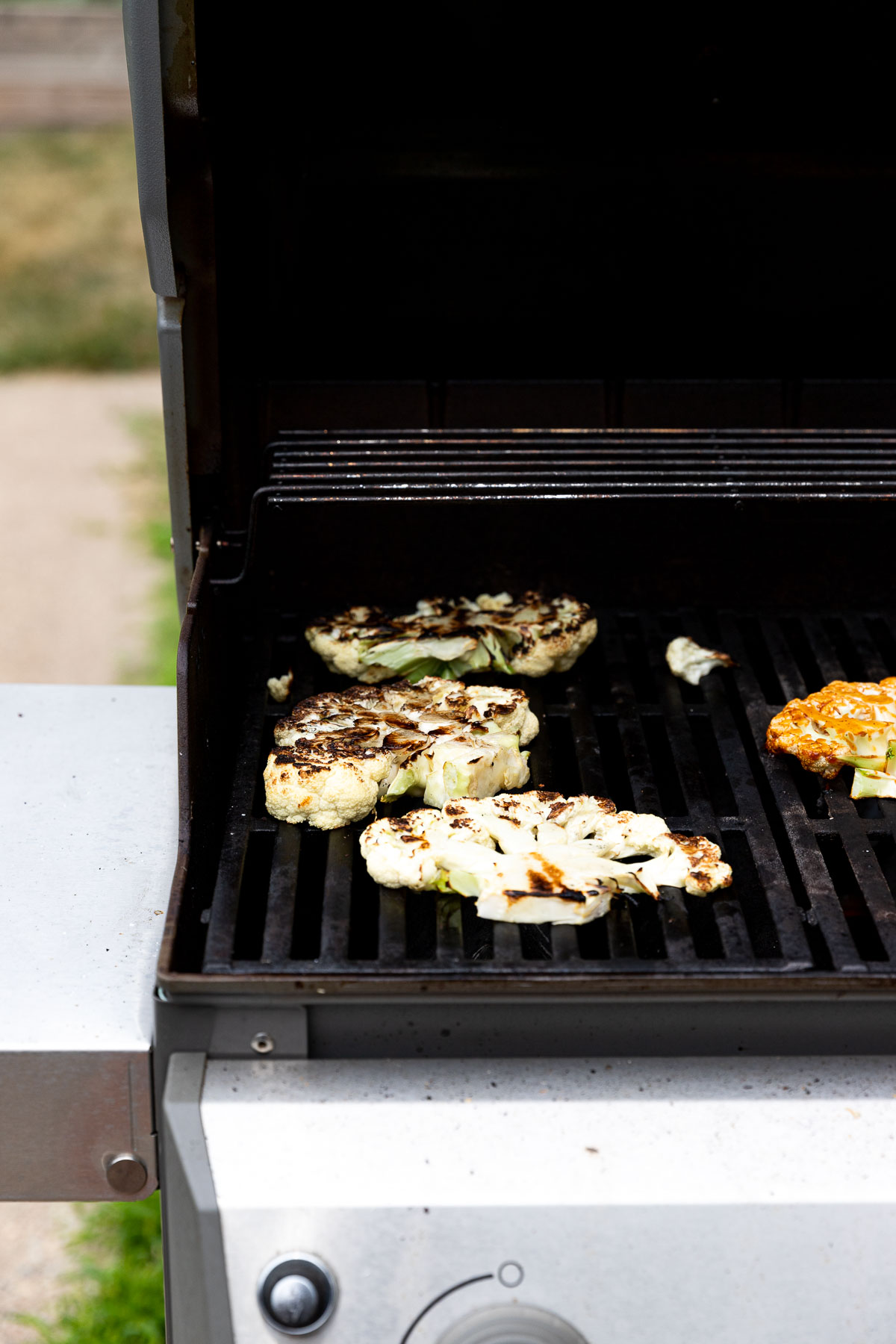 Cauliflower steaks on the grill.