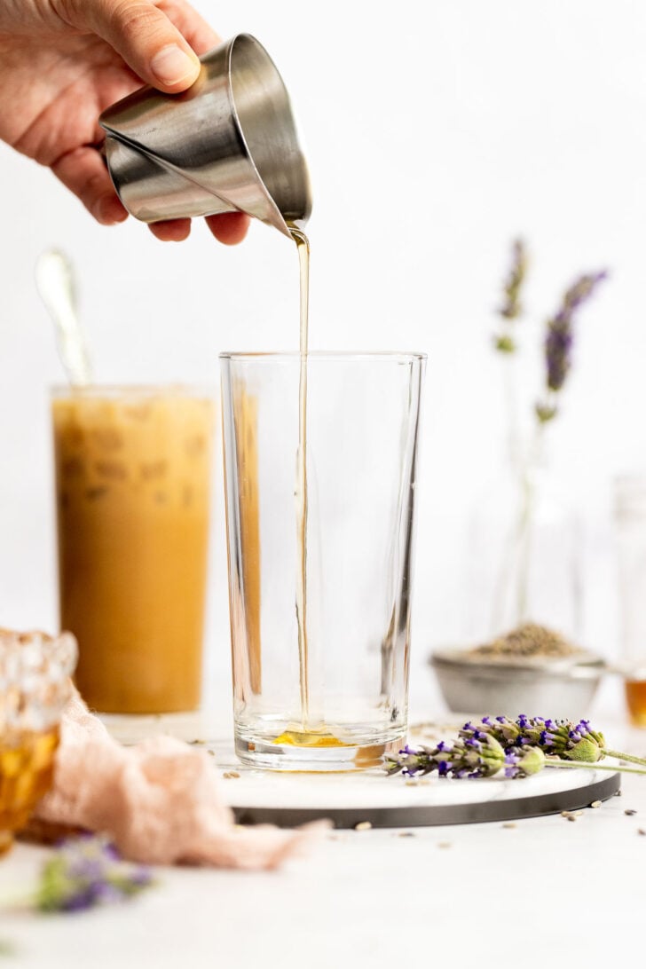 Honey Lavender Syrup pouring into glass.