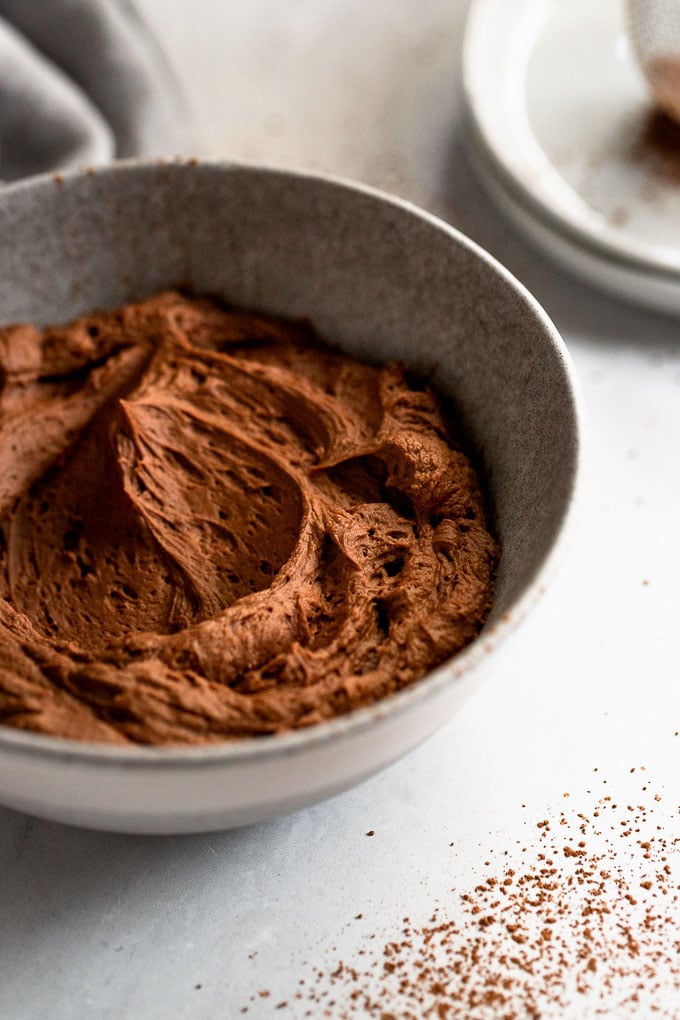 Chocolate buttercream icing in bowl.