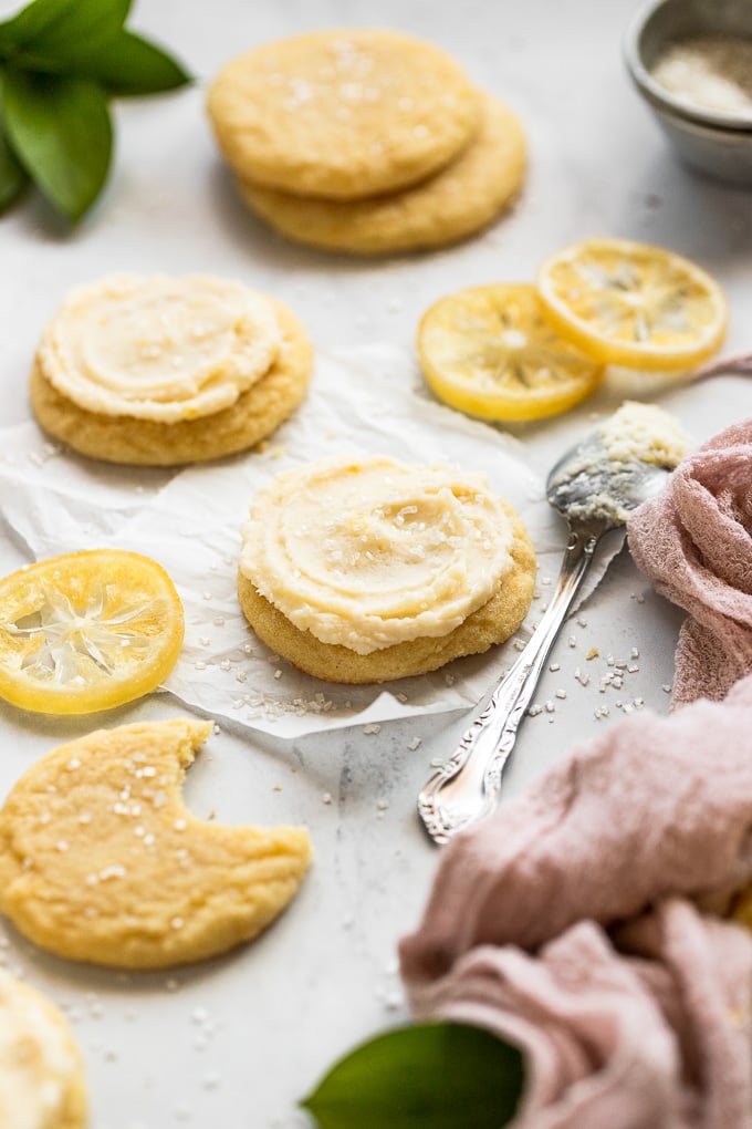 Lemon sugar cookies with frosting on table.