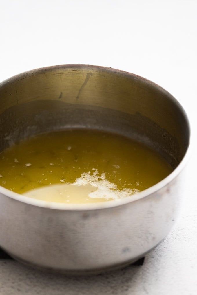 Saucepan with melted butter.