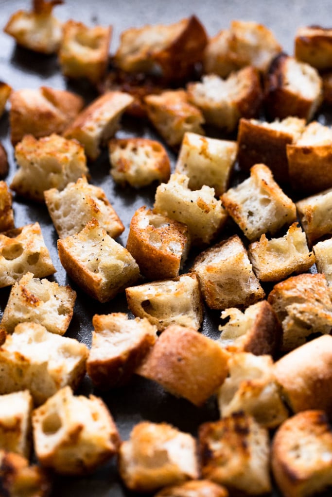 Homemade croutons on tray. 