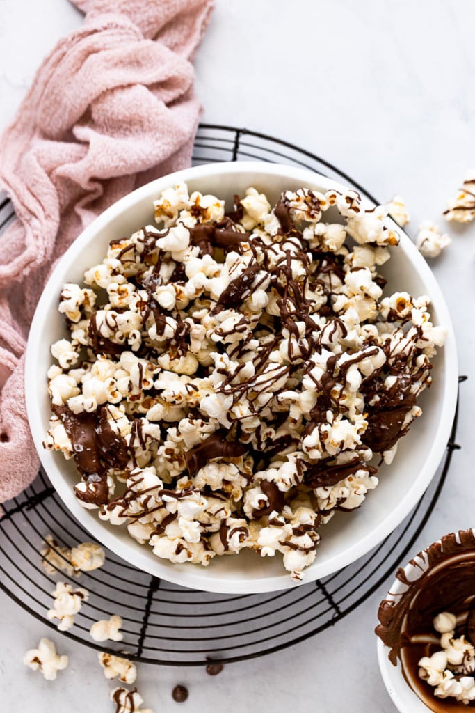 Bowl of chocolate drizzled popcorn.