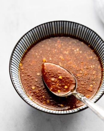 Sauce in bowl with spoon.
