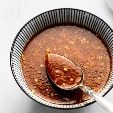Sauce in bowl with spoon.