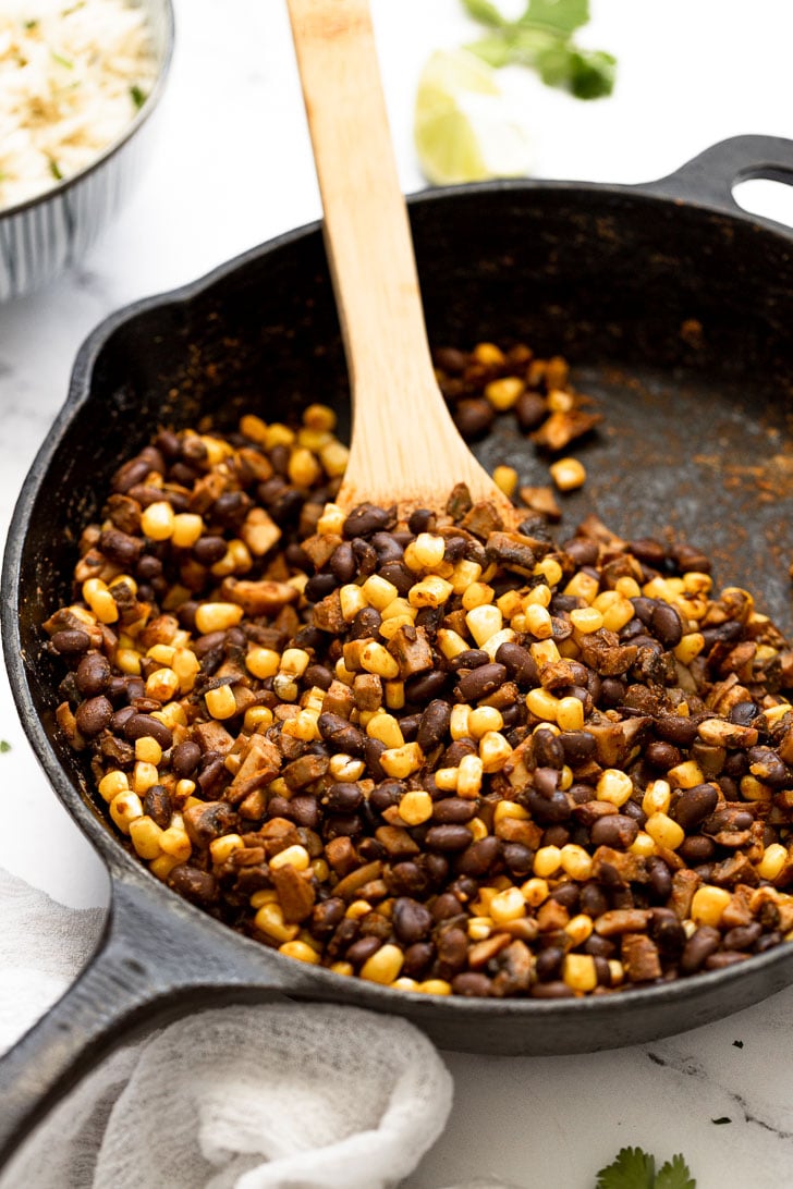 Skillet with mushrooms, corn, and black beans.