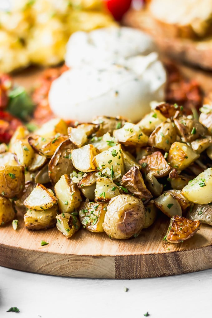 Crispy potatoes on breakfast board.