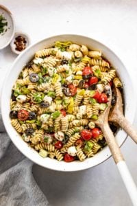 Bowl of pasta salad with spoons.