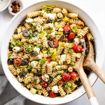 Bowl of pasta salad with spoons.