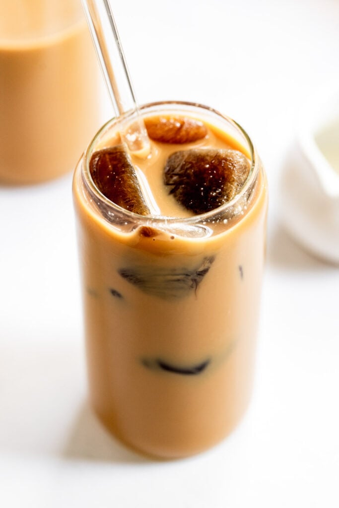 Iced coffee with cream and coffee ice cubes.