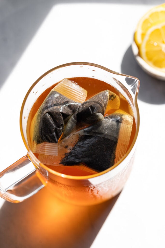 Pitcher with tea bags and water.