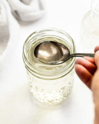 Spoon in jar of simple syrup.