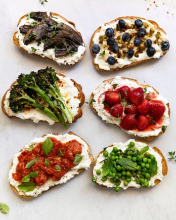 6 ricotta toast toppings on white background: strawberry, broccolini, tomato, mushroom, honey, and pea.