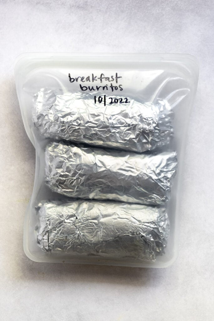 Burritos wrapped in foil in Stasher bag.