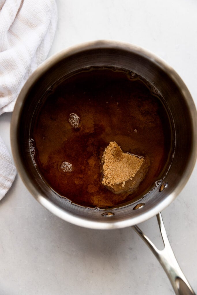 Saucepan with brown sugar and water.