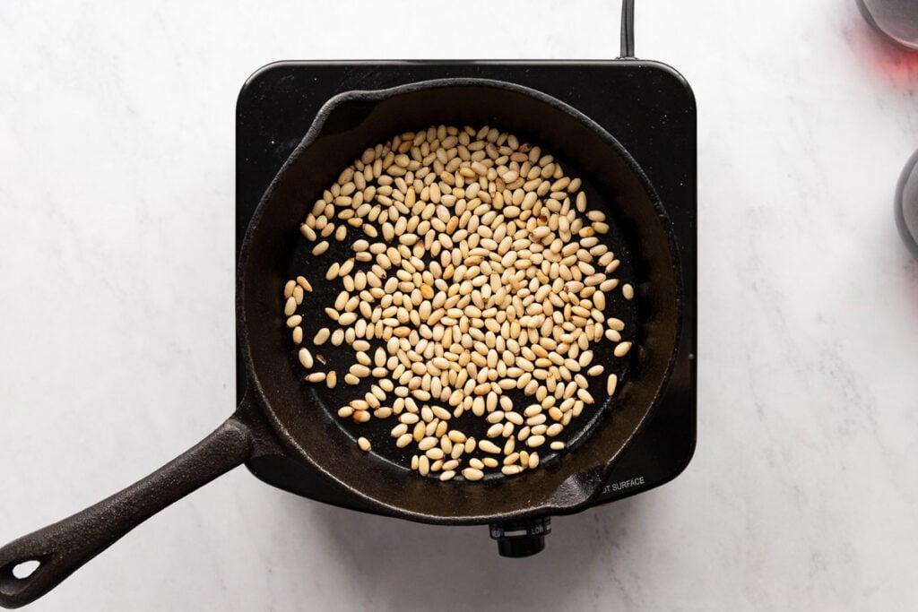 Skillet with pine nuts.