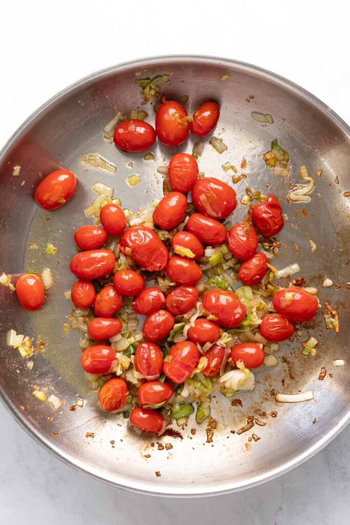 Softened tomatoes in skillet.