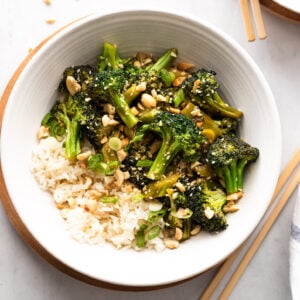Bowl of broccoli stir fry with white rice.