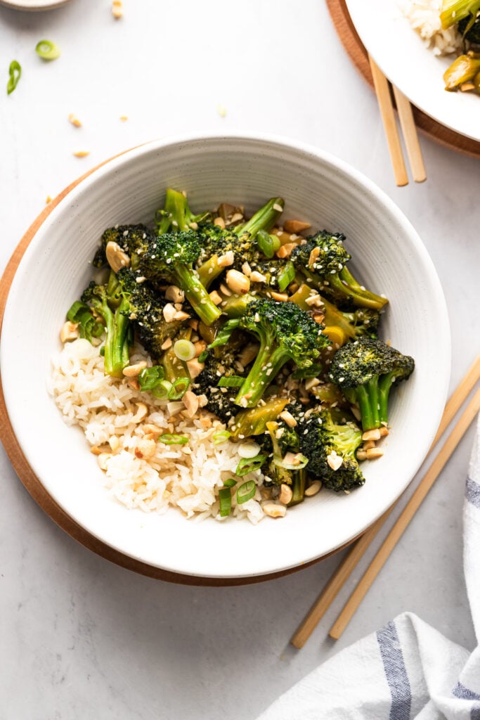 Bowl of broccoli stir fry with white rice.