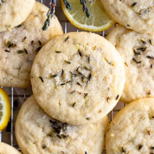 Pile of lavender lemon sugar cookies on cooling rack.