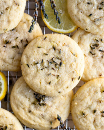 Pile of lavender lemon sugar cookies on cooling rack.