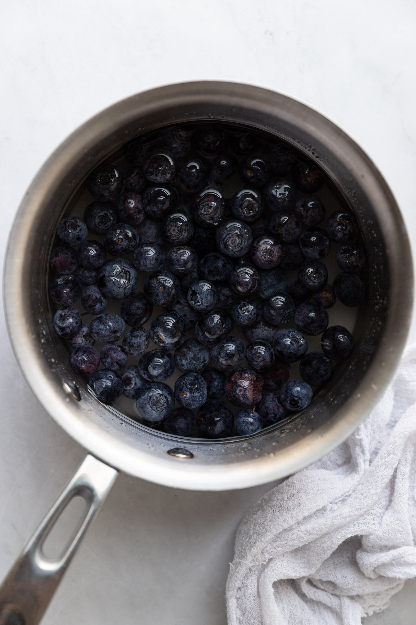 Saucepan with blueberries before simmering.