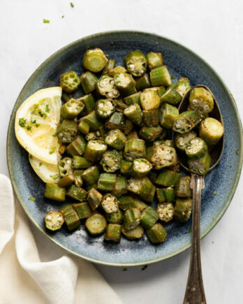Plate of air fried okra with spoon.