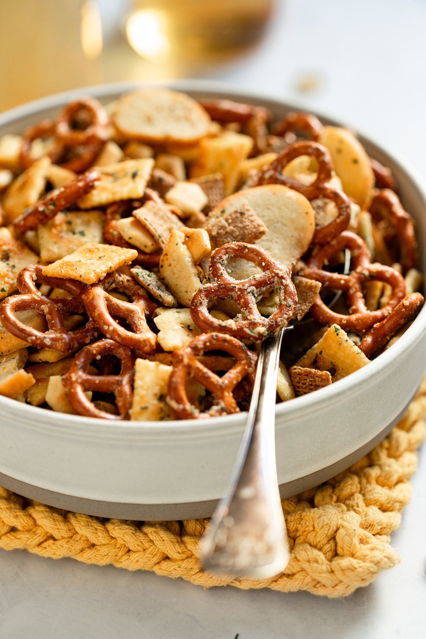 Side view of bowl of ranch snack mix.