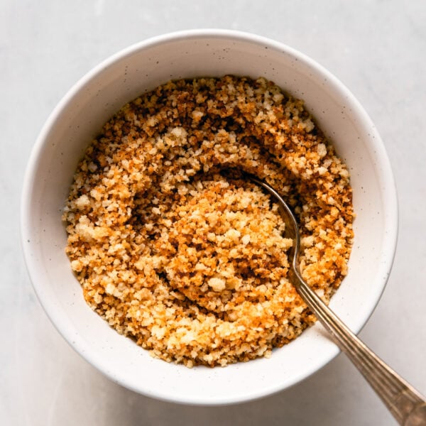 Toasted Breadcrumbs in bowl with spoon.