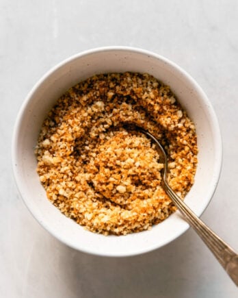 Toasted Breadcrumbs in bowl with spoon.