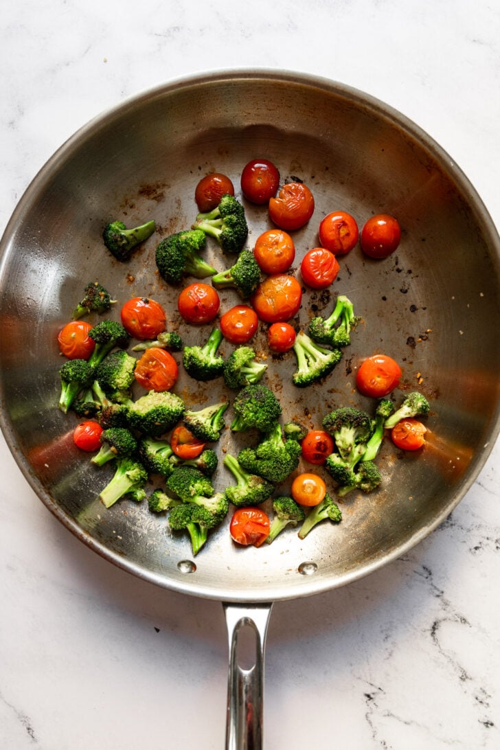 Tomatoes and broccoli in skillet.