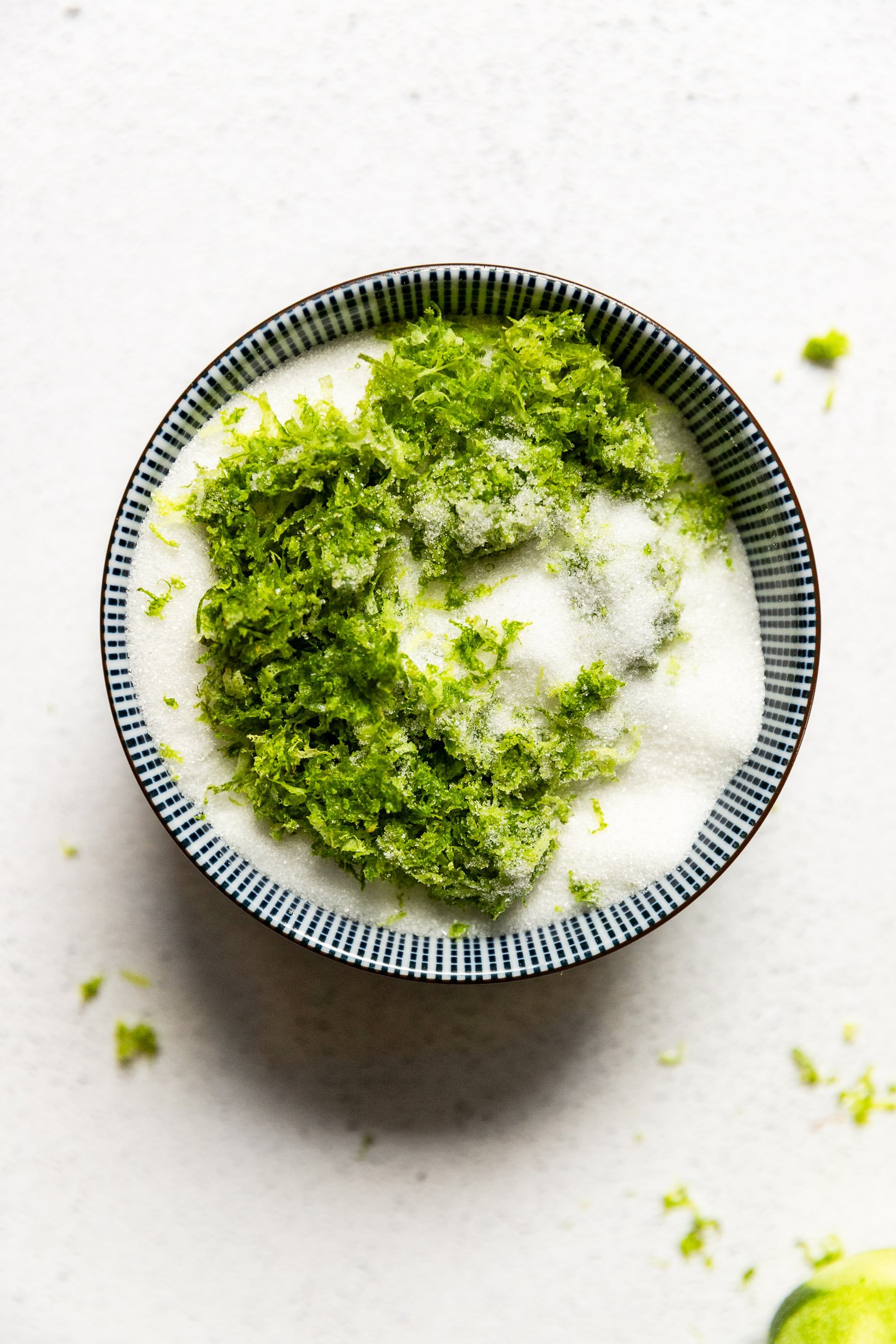 Bowl of sugar with lime zest.