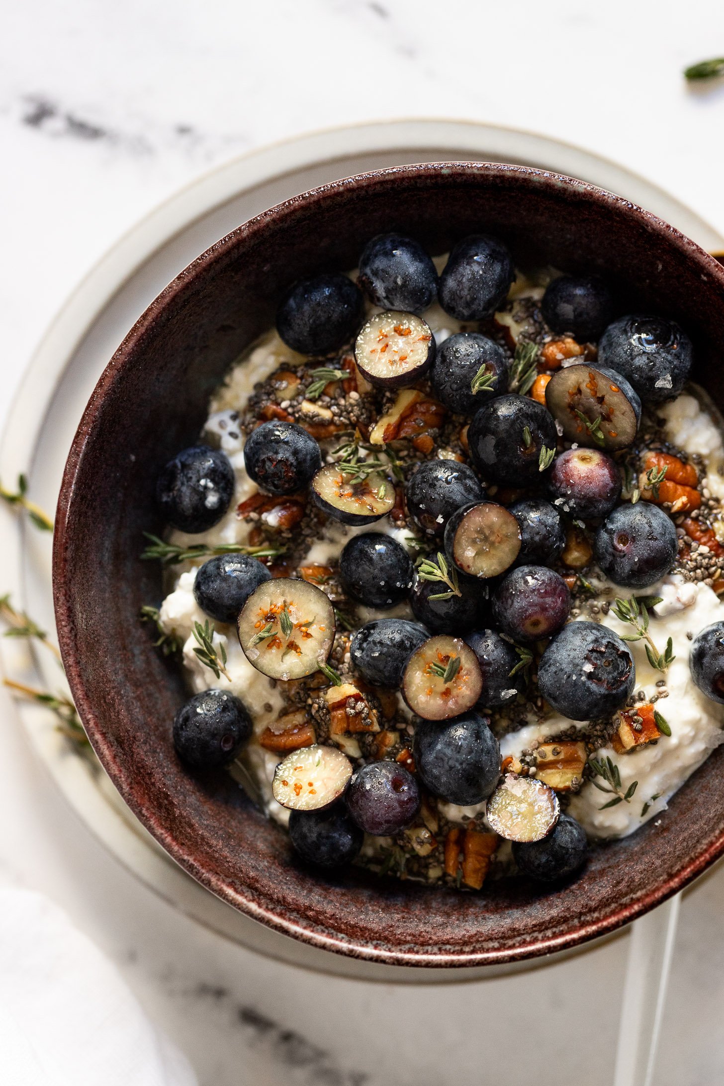 Overhead view of cottage cheese snack bowl with blueberries.